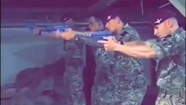 Screenshot of soldiers firing side arms at an image of Jeremy Corbyn. Pic: Twitter Screenshot of soldiers firing side arms at an image of Jeremy Corbyn. Pic: Twitter