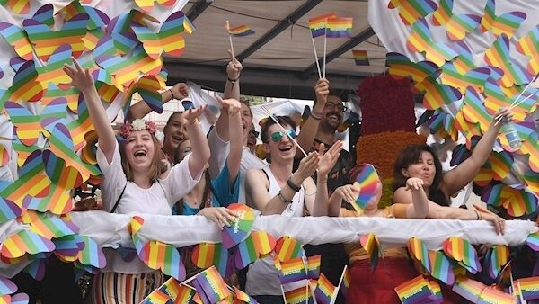 People wave rainbow flags and wear costumes during the Baltic gay pride parade on Saturday on the streets of the Polish capital Warsaw. Pictures: Janek Skarzynsk