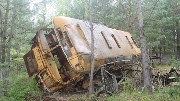 An abandoned bus near the location of the 1986 Chernobyl nuclear power plant disaster, is slowly consumed by time and nature. Picture: Caroline O’Doherty An abandoned bus near the location of the 1986 Chernobyl nuclear power plant disaster, is slowly consumed by time and nature. Picture: Caroline O’Doherty