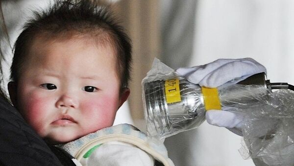 A baby is screened at an evacuation centre for leaked radiation from the damaged Fukushima nuclear facilities, in the city of Fukushima, northeastern Japan, on Thursday March 24, 2011. Picture: AP Photo/Kyodo News A baby is screened at an evacuation centre for leaked radiation from the damaged Fukushima nuclear facilities, in the city of Fukushima, northeastern Japan, on Thursday March 24, 2011. Picture: AP Photo/Kyodo News