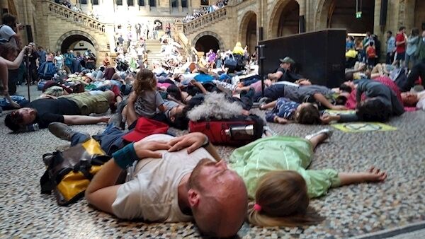 Extinction Rebellion protestors lying down inside the Natural History Museum in London. (Laura Parnaby/PA Wire)