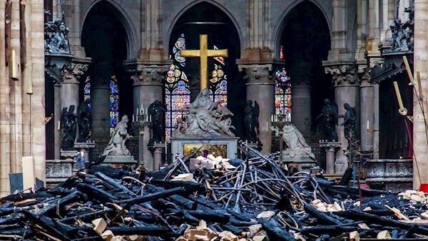 Debris inside Notre Dame cathedral in Paris after the blaze was quenched. Picture: Christophe Petit Tesson, Pool via AP