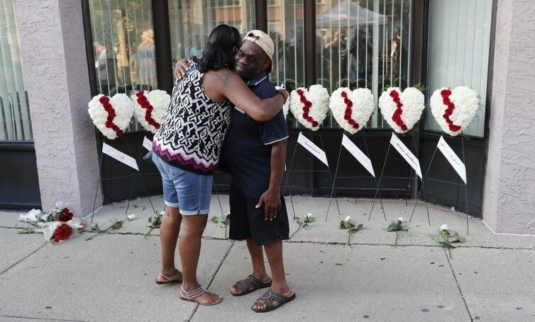 Wreaths are laid for the victims of the Ohio attack. EPA/David Kohl Wreaths are laid for the victims of the Ohio attack. EPA/David Kohl