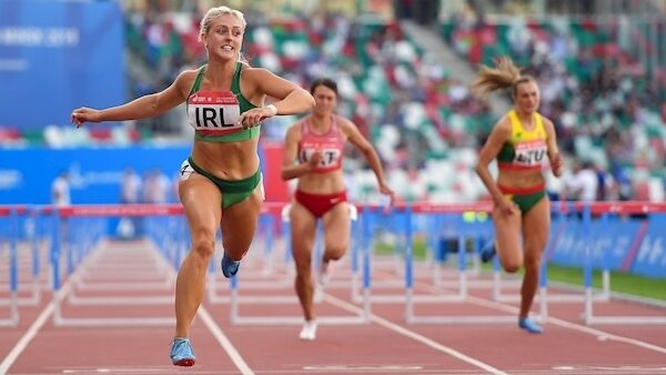 Sarah Lavin of Ireland, left, finishes second in the Women's 100m hurdles during Dynamic New Athletics qualification on Day 3. Pic: Sportsfile