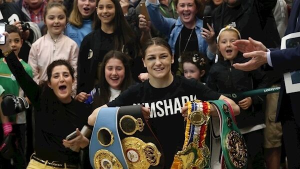Katie Taylor shows off her belts at Dublin Airport. Picture: Sam Boal/RollingNews.ie