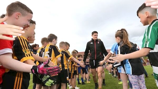 Derry captain Chrissy McKaigue leads the team onto the pitch at the Sean Dolan’s club in the Creggan estate of Derry City last week. Picture: Margaret McLaughlin