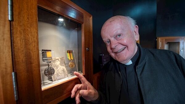 Fr Eddie Griffin, Bray, Co Wicklow looking at a picture of his father Tom Griffin, Ballynoe who was internee on Spike. Picture Dan Linehan