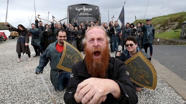 Richard Hodgen, a guide with the Game of Thrones Tour in Northern Ireland, pictured with a party of tourists at Ballintoy harbour on the north Antrim coast. Ballintoy was one of the film locations for the series. Picture: Stephen Davison. Richard Hodgen, a guide with the Game of Thrones Tour in Northern Ireland, pictured with a party of tourists at Ballintoy harbour on the north Antrim coast. Ballintoy was one of the film locations for the series. Picture: Stephen Davison.