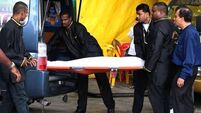 Six charged with New Delhi murder as woman's body is cremated