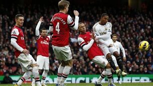 Swans flying on black day for Arsenal 