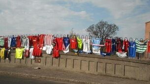 Liam Whelan bridge covered with jerseys in touching tribute