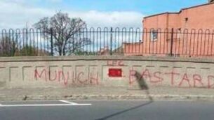 Football fans undo work of vandals at memorial bridge