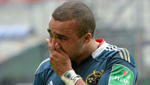 Munster winger Simon Zebo tries to hide his disappointment