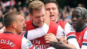 Mertesacker urges Gunners to press on