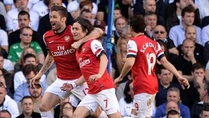 Gunners stay in hunt as Sherwood’s strife grows
