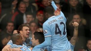 Dzeko double decks United