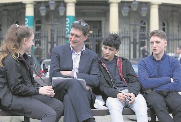 Green Party leader Eamon Ryan speaking to his children outside Leinster House yesterday