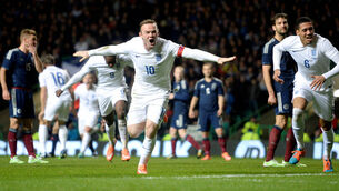 Rooney double silences Scotland 