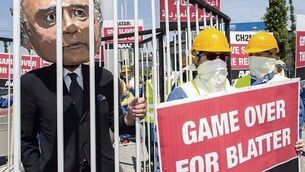 Sepp Blatter hangs on amid Fifa fall-out