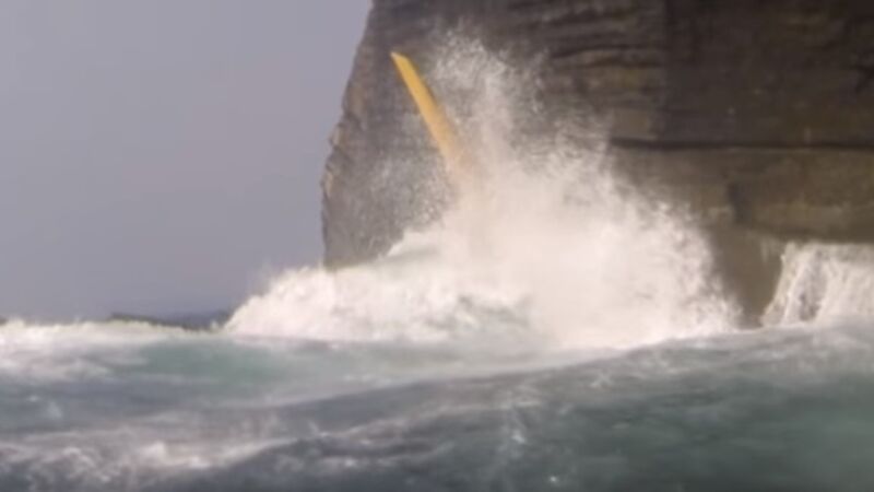 Watch as kayaker has very near miss with cliff after being swept up in freak wave Watch as kayaker has very near miss with cliff after being swept up in freak wave