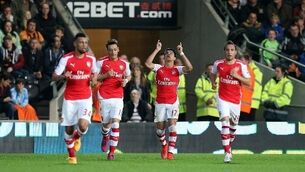 Arsenal cruise past tame Hull