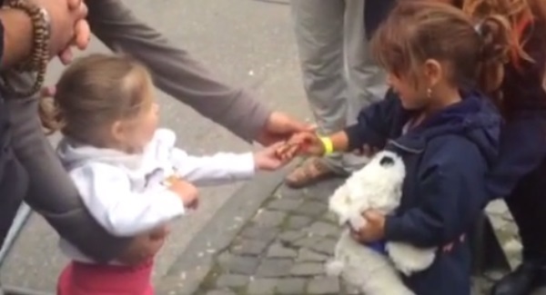 WATCH: The sweet moment a German toddler welcomes a newly-arrived refugee