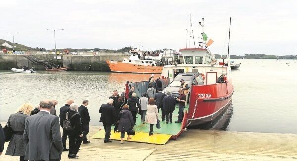 Mourners boarding the Yoker Swan Ferry for the burial of Youen Jacob on Sherkin Island yesterday. Discussing how Youen came to Baltimore in the first place, Fr O’Donovan said: ‘Just the fact the boat came in here, even though it was destined for Galway, is so typical of life and the twists and turns.’ Picture: Denis Scannell