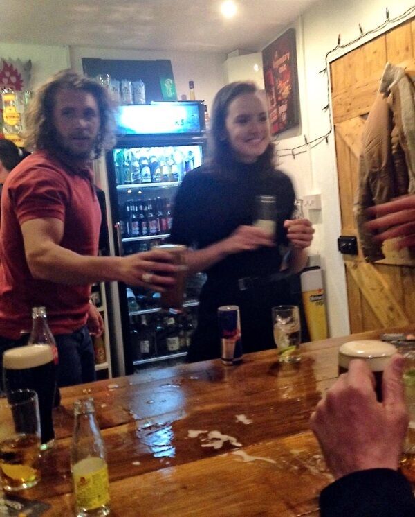 Daisy Ridley gives a helping hand behind the bar at the Star Wars wrap party in Foxy John’s pub in Dingle, Co Kerry.
