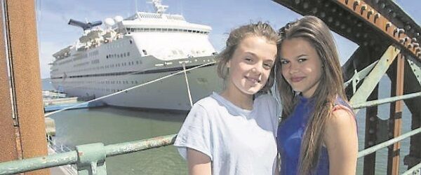 Smooth sailing for Junior Cert students Michelle Cronin, Coláiste Mhuire, and Kristyna Zigova, Cobh Community College, as they pose before the cruise ship Magellan in Cobh. Picture: Dan Linehan