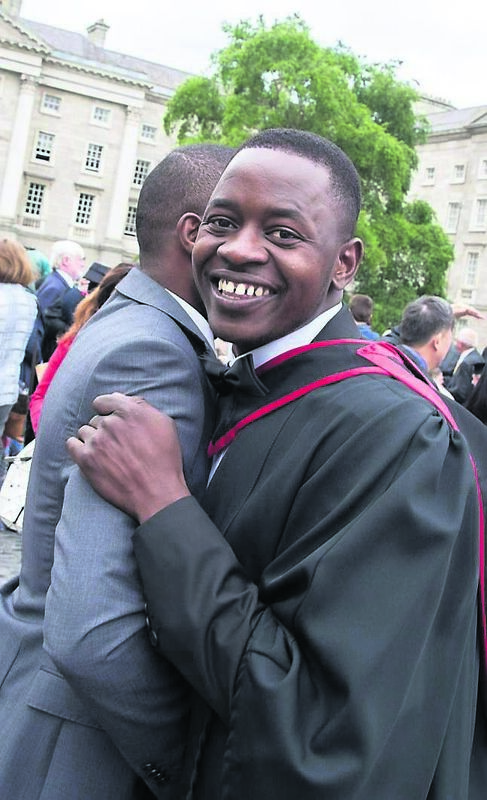 Andre Maseko is congratulated by a friend after receiving a degree in medicine from Trinity. Picture: Paul Sharp/Sharppix Andre Maseko is congratulated by a friend after receiving a degree in medicine from Trinity. Picture: Paul Sharp/Sharppix