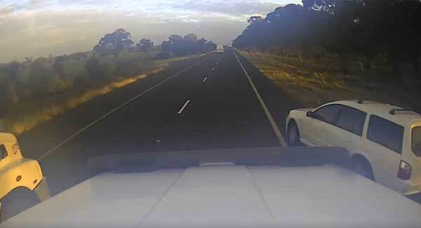 Dashcam footage shows terrifying moment car swerves in front of two trucks