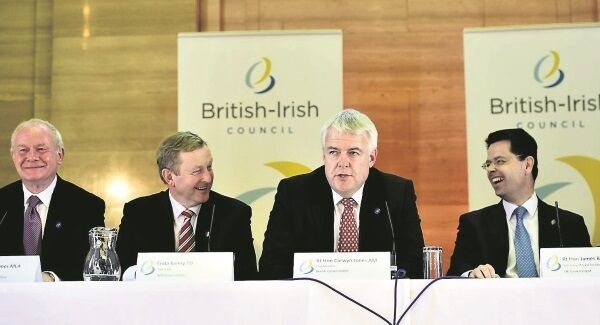 Wales first minister Carwyn Jones, second right, cracks a joke as he is asked a question in Welsh, provoking laughs from the North’s deputy first minister Martin McGuinness, Taoiseach Enda Kenny, and Northern Ireland secretary of state James Brokenshire during a press conference following the British-Irish Council meeting. Picture: Ben Birchall