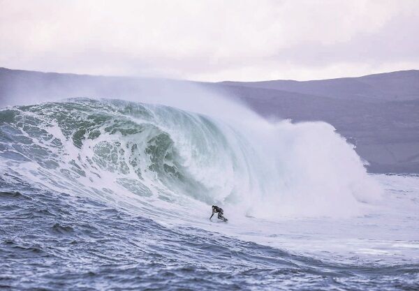 Andrew Cotton in the midst of a big swell, as featured in the documentary ‘Beneath the Surface’, which follows the English adventurer and a team of fellow surfers and thrill-seekers as they chase a wave off the west coast of Ireland.