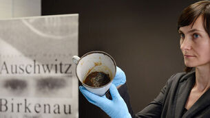 Auschwitz museum staff find jewellery hidden in false base of mug