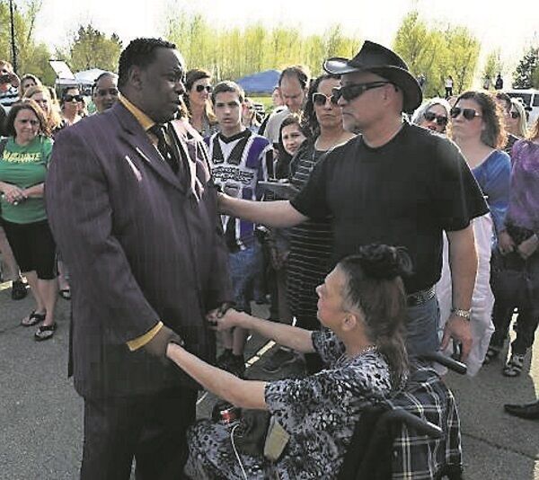 Maurice Phillips, (L) the brother-in-law of Prince, talks with fans outside Paisley Park. Pic: Getty