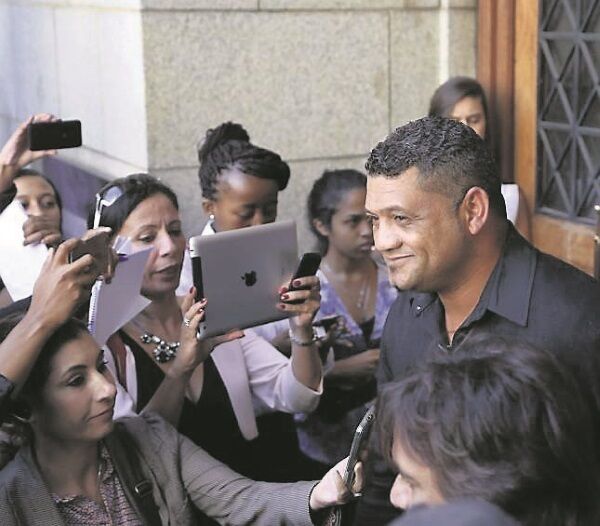 Zephany’s father, Morne Nurse, is surrounded by reporters as he leaves the court in Cape Town