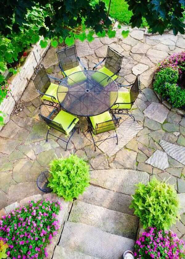 Landscaped Stone Patio Back Yard with Garden and Flower Beds