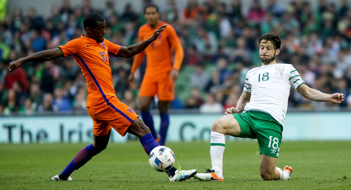 Ireland's Harry Arter gets the ball away ahead of Holland's Georginio Wijnaldum. Photo: INPHO/Tommy Dickson