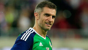 Aaron Hughes takes 100th cap in his stride