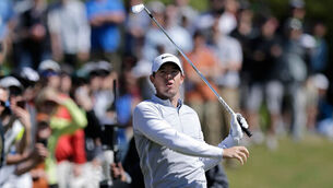 Relieved Rory McIlroy survives play-off