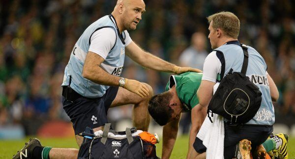 Dr Eanna Falvey (left) and James Allen tend to Jonathan Sexton in 2015