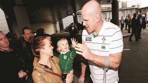 Rugby fans high five their heroes as Irish team arrives home to Dublin
