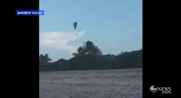 Watch the terrifying moment man falls from paraglider high in the air