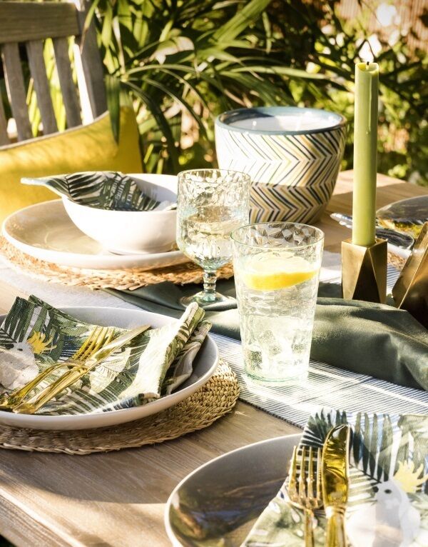 Melamine and plastic might do for rough housing, but get out some proper flatware and glass for those special occasions. Lay on the tropical bling with golden forks and palm print linens, new from House of Frasers much feted Linea line.