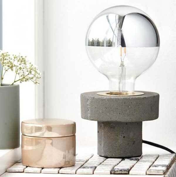 Gentle industrial continues to charm and the Edison variety is a perfect table foil for larger pendants. Concrete and ballon style forms taken from the shape of light bulbs , this combination of concrete and glass and is coated to throw light down to the surface. It features a nice brass collar connecting the elements and a feature cord. Aprilandthebear.com, €78