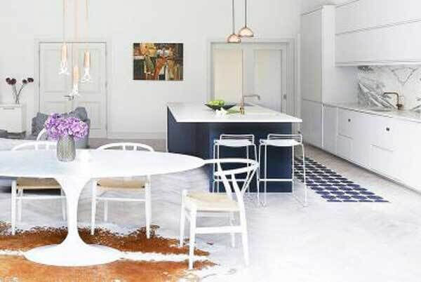 Saarinen marble table with three copper Plumen bulbs, a copper Arne Jacobsen kitchen tap and two small copper Tom Dixon pendants, form this kitchen brief.