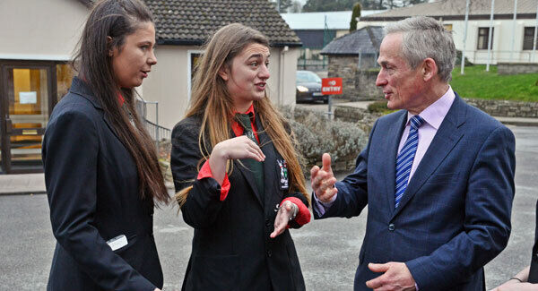 Richard Bruton chats with Leaving Certificate students Erin Kingston, Enniskean, and Ruby Knox, Castlegregory, at Bandon Grammar School.