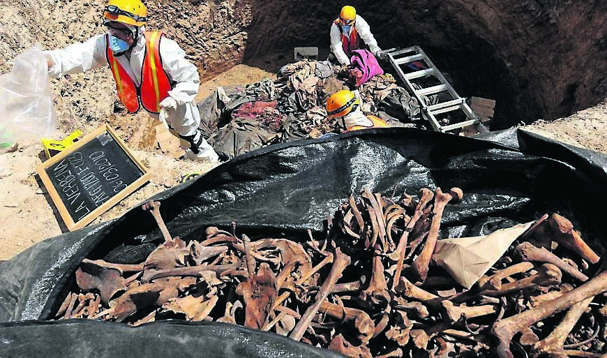 Forensic anthropologists exhume bodies in Guatemala City. It is one of the most dangerous cities in the world, ravaged by drug and gang violence.