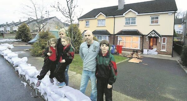 Dominick and Aisling McAvoy and their children Dylan, 11, Lauren, 8, and Liana, 4, outside their flood damaged home in Copper Valley Vue, Glanmire, Co, Cork. Picture: Denis Scannell