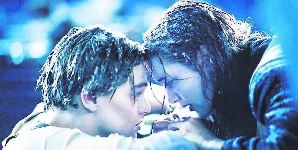 Jack (Leonardo diCaprio) begs Rose (Kate Winslet) to promise him that she will survive on a raft in the icy Atlantic in ‘Titanic’.